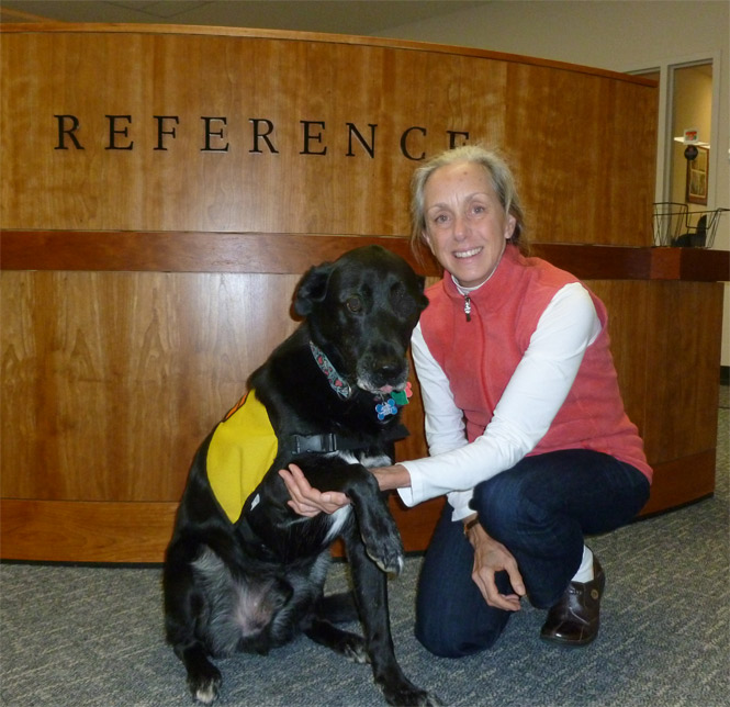 Jeb on one of his frequent visits to the reference desk, with Teresa.